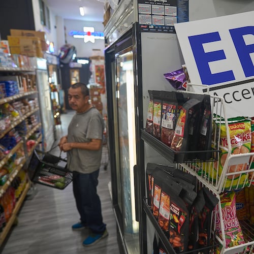 FILE - A banner reads: "EBT (Electronic Benefit Transfer) Accepted Here," at El Recuerdo Market in Los Angeles, Oct. 31, 2025, after two federal judges ordered President Donald Trump's administration to continue funding SNAP during the government shutdown. (AP Photo/Damian Dovarganes, file)