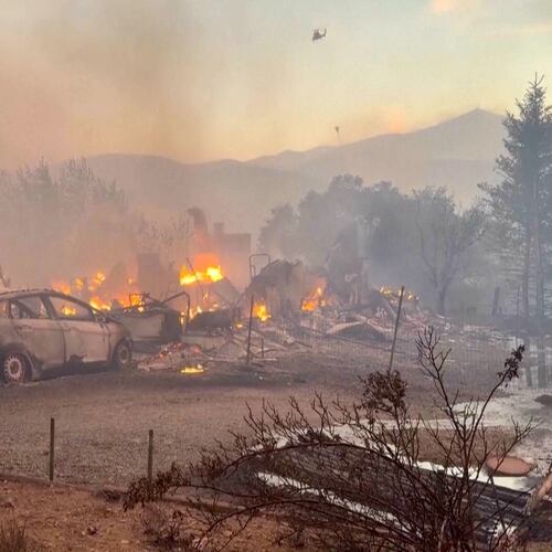This image taken from video shows a charred neighborhood following wildfires Saturday, Aug. 22, 2026, in Reno, Nevada. (Tim Walton via AP)
