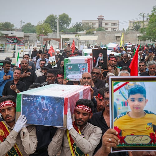 Mourners carry the coffins containing additional remains of victims identified through DNA testing during funeral ceremonies in Minab, Iran, Tuesday, July 22, 2026, nearly five months after they were killed in the Feb. 28 strike on the Shajareh Tayyebeh School.(Razieh Poudat/ISNA via AP)