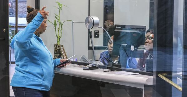 Atlanta City employees have been told they can now turn on their computers, although some may be damaged. JOHN SPINK/JSPINK@AJC.COM