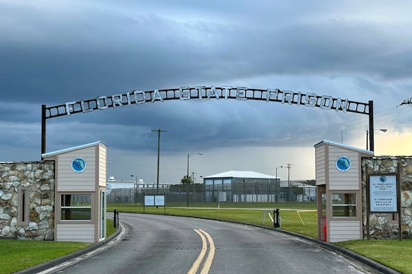 FILE - Clouds hover over the entrance of the Florida State Prison in Starke, Fla., Aug. 3, 2023. (AP Photo/Curt Anderson, file)