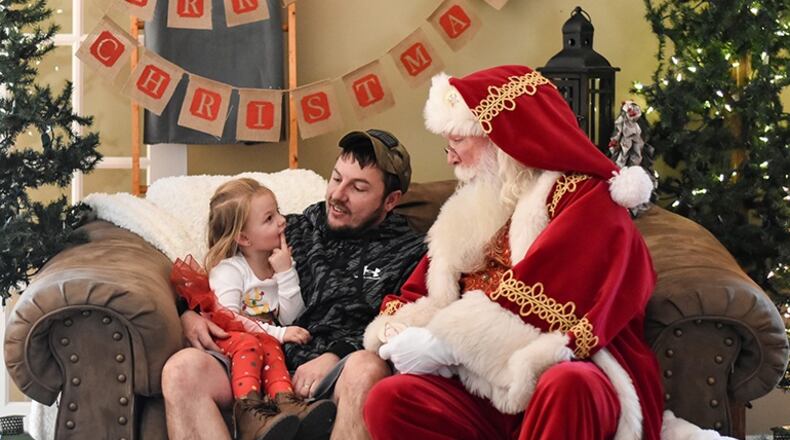 Derek Dugan of Buford, known as “Santa Derek," helped other Santas this year with setting up home studios for virtual visits with children. Dugan's schedule this year includes a mix of in-person and online Santa appearances.