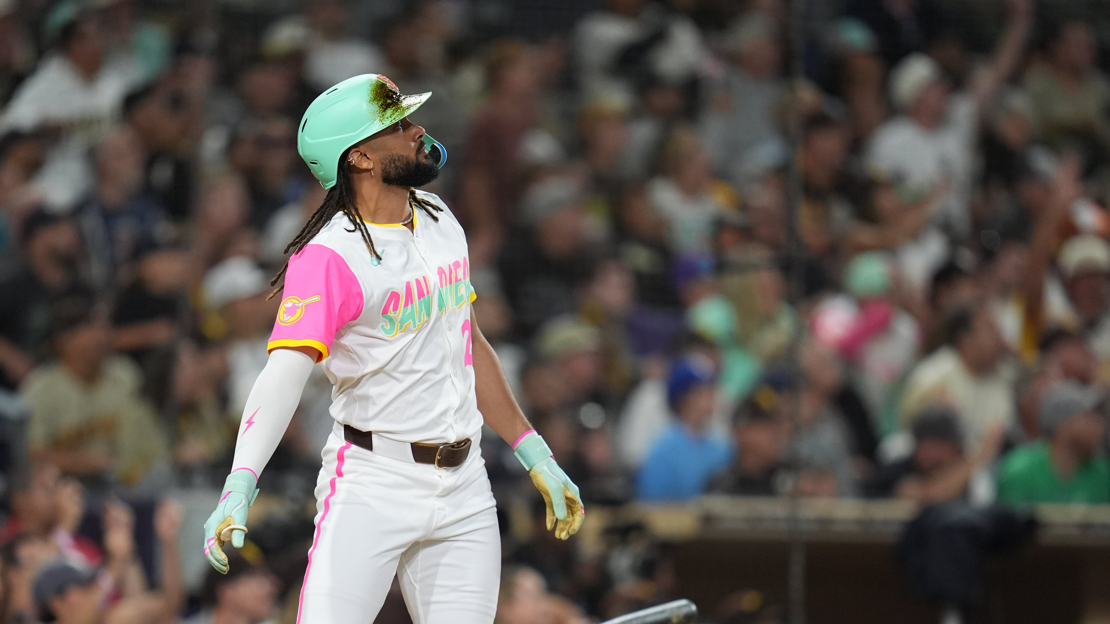 San Diego Padres' Fernando Tatis Jr. watches his grand slam during the fourth inning of a baseball game against the Arizona Diamondbacks Friday, Sept. 26, 2025, in San Diego. (AP Photo/Gregory Bull)