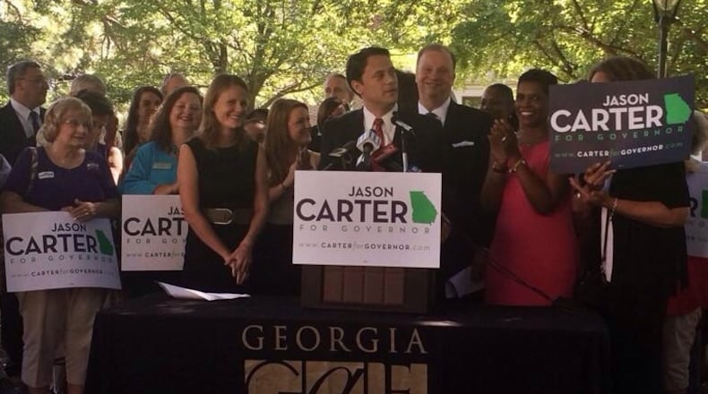 Jason Carter speaks as his wife Kate chuckles.