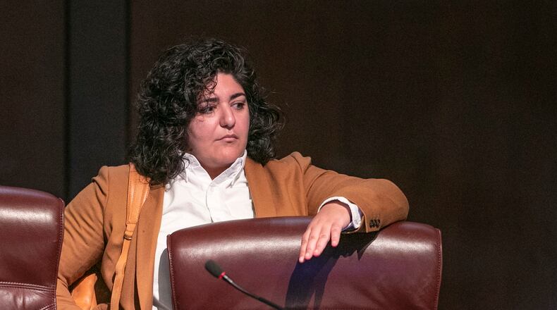 Council member Liliana Bakhtiari prepares to take her seat on the dais as the Atlanta City Council held their first in person meeting since they were suspended at start of the pandemic In Atlanta on Monday, March 21, 2022. (Bob Andres / robert.andres@ajc.com)