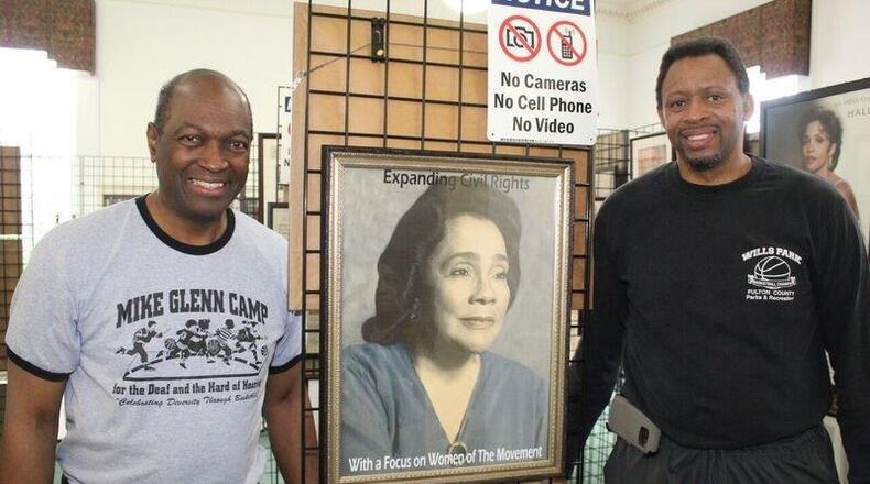 This painting of Coretta Scott King is on dispaly at Mike Glenn’s exhibit “Expanding Civil Rights: With a Focus on Women of the Movement” at the Decatur library. That’s Glenn on the left and Willie Brown, who played at Hofstra and Georgia State, and probably remains the only fully-deaf, full-scholarship athlete to play Division I basketball. Courtesy of Greg White