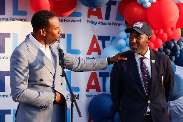 Mayor Andre Dickens thanks Atlanta Transportation Commissioner Solomon Caviness during an event celebrating the reopening of Cascade Road in Atlanta on Wednesday, Aug. 27, 2025. (Abbey Cutrer/AJC)