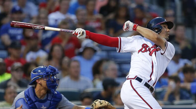 Atlanta Braves’s Jace Peterson follows through on a two-run double in the fourth inning Monday against the Los Angeles Dodgers at Turner Field in Atlanta. (John Bazemore / AP)