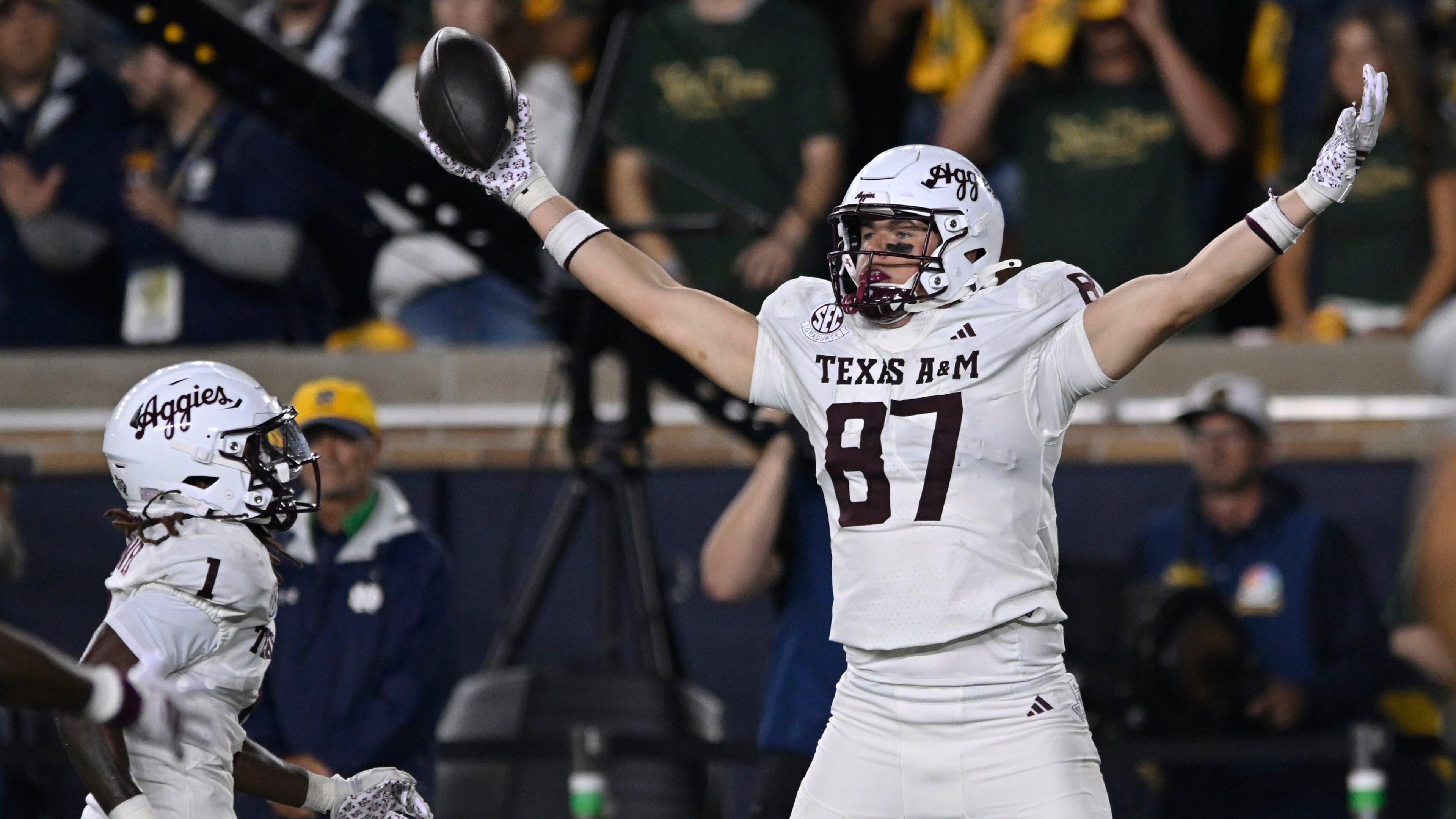 Texas A&M's Nate Boerkircher (87) celebrates after catching a touchdown pass during the fourth quarter of an NCAA football game against Notre Dame, Saturday, Sept. 13, 2025, in South Bend, Ind. (AP Photo/Paul Beaty)