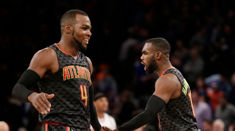 Atlanta Hawks’ Paul Millsap, left, and Tim Hardaway Jr. celebrate after an NBA basketball game against the New York Knicks, Monday, Jan. 16, 2017 in New York. The Hawks defeated the Knicks 108-107. (AP Photo/Seth Wenig)