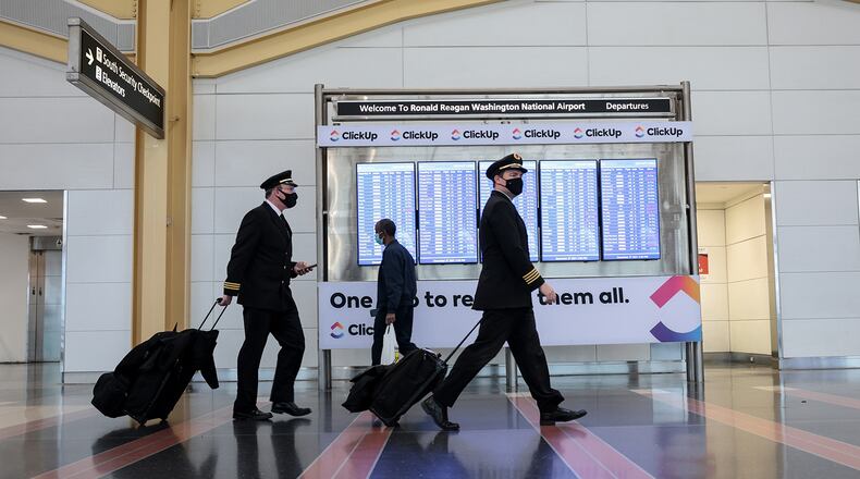 Airline pilots walk through the Ronald Reagan Washington National Airport on Dec. 27, 2021, in Arlington, Virginia. (Anna Moneymaker/Getty Images/TNS)