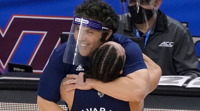 Georgia Tech coach Josh Pastner and senior guard Jose Alvarado celebrate after Saturday's 80-75 victory over Florida State in the championship game of the ACC Tournament in Greensboro, NC.