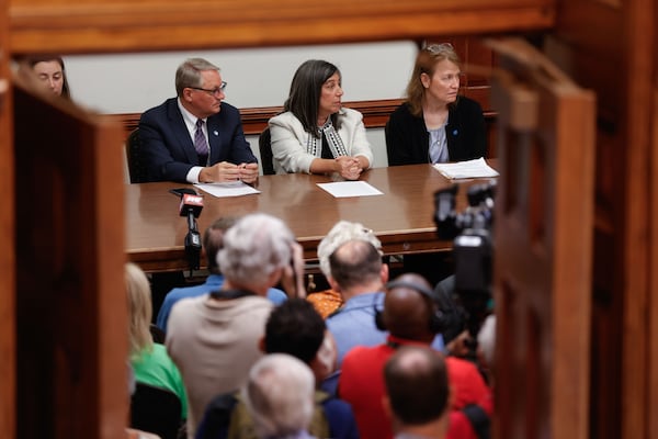 Abby Tighe (from left, face obscured by the door), Dr. Dan Jernigan, Dr. Debra Houry and Dr. Barbara Marston testify during a meeting at the Georgia Capitol on Tuesday, Sept. 2, 2025, days after some of them resigned en masse from the Centers for Disease Control and Prevention. (Natrice Miller/AJC)