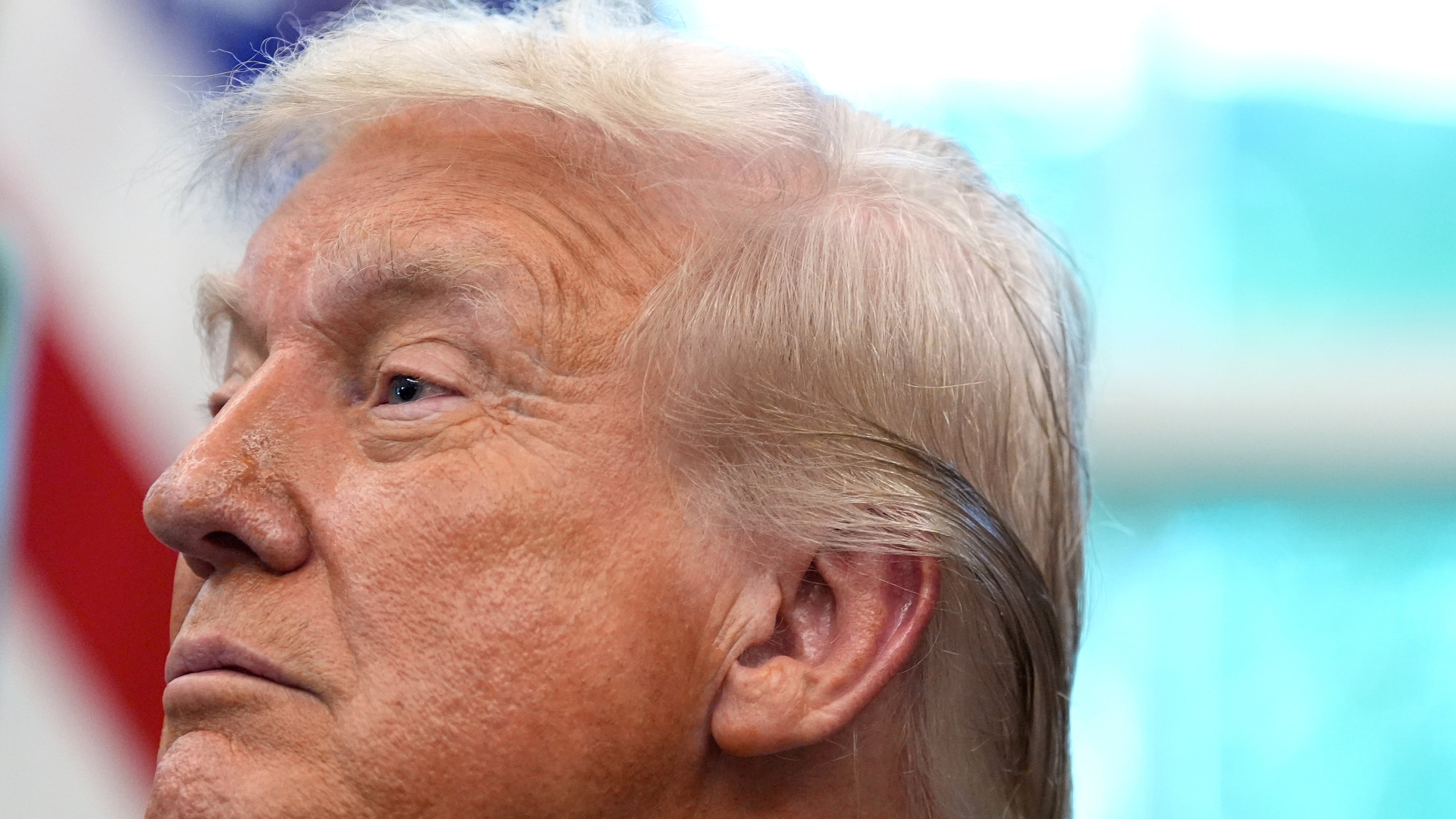 President Donald Trump listens in the Oval Office of the White House, Monday, Sept. 15, 2025, in Washington. (AP Photo/Alex Brandon)