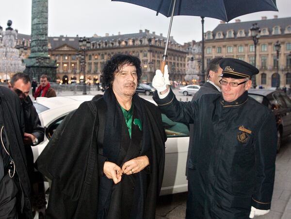 FILE - Libyan Col. Muammar Gadhafi arrives for a meeting with intellectuals at the Ritz Hotel in Paris, Dec. 11, 2007. (AP Photo/Francois Mori, File)