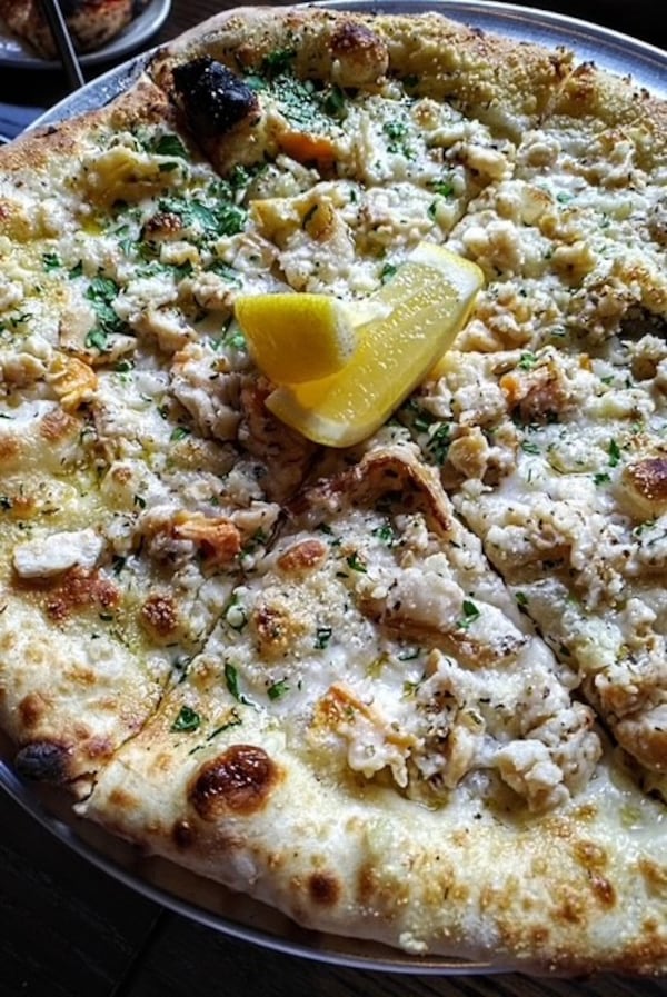 Krog Bar has opened in Peachtree Hills with coal-fired pizza like the surf clam. (Courtesy of Krog Bar)
