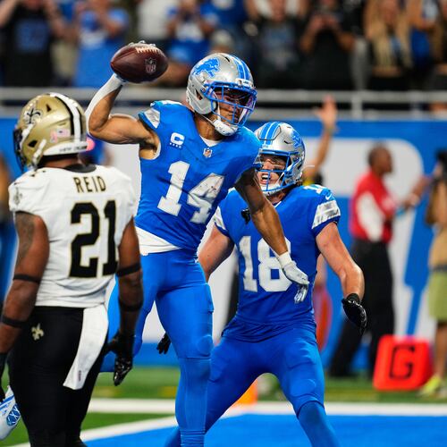 Detroit Lions wide receiver Amon-Ra St. Brown (14) celebrates his touchdown reception during overtime of an NFL football game against the New Orleans Saints, Sunday, Sept. 13, 2026, in Detroit. (AP Photo/Paul Sancya)