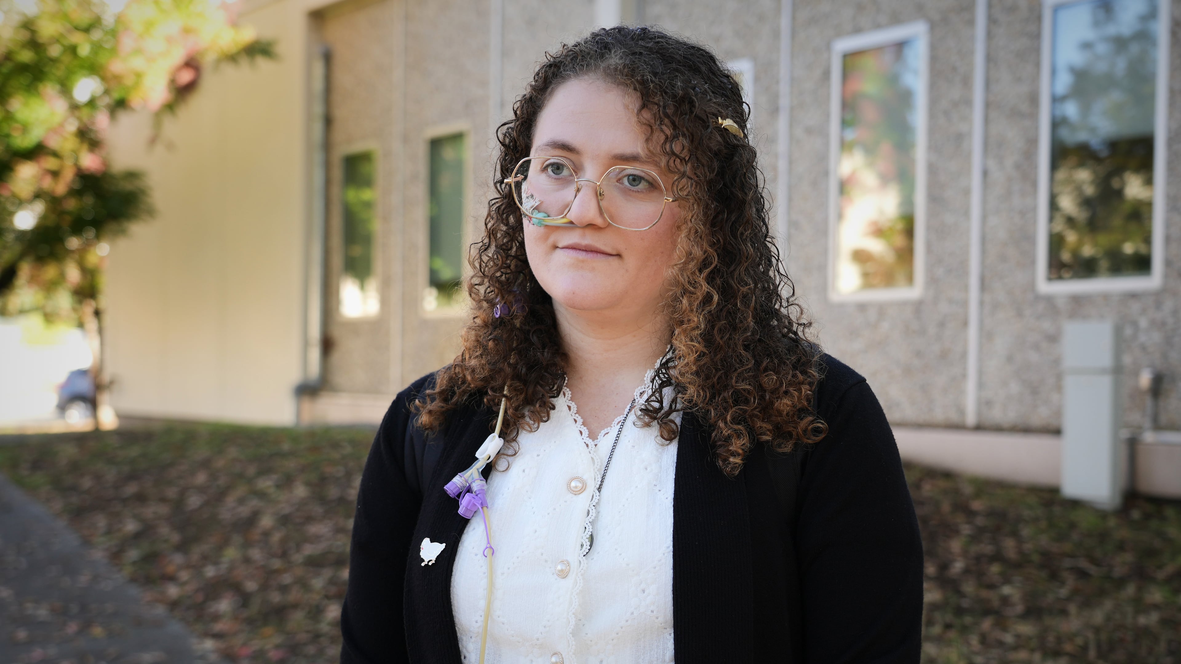 Animal rights activist Zoe Rosenberg, who is on trial for taking four chickens from one of Perdue Farms' major poultry plants, is pictured outside Sonoma County Superior Court in Santa Rosa, Calif. on Tuesday, Oct. 28, 2025. (AP Photo/Terry Chea)