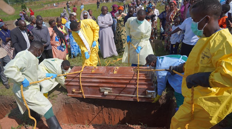 Health workers bury the coffin of Neema Minaro, a 66 year old woman who died of the Ebola virus, in Bunia, Congo, Wednesday, Sept. 2, 2026. (AP Photo/Dieudonne Dirole)