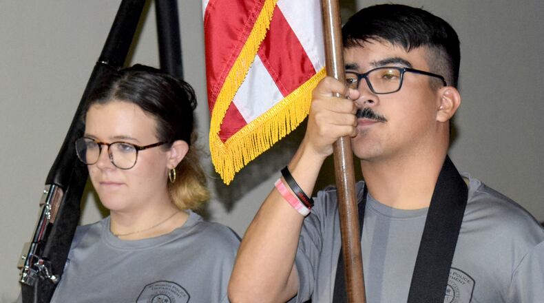 Kirsten Combs (left) and Kamran Padilla practice drills during a recent Acworth police cadets meeting.