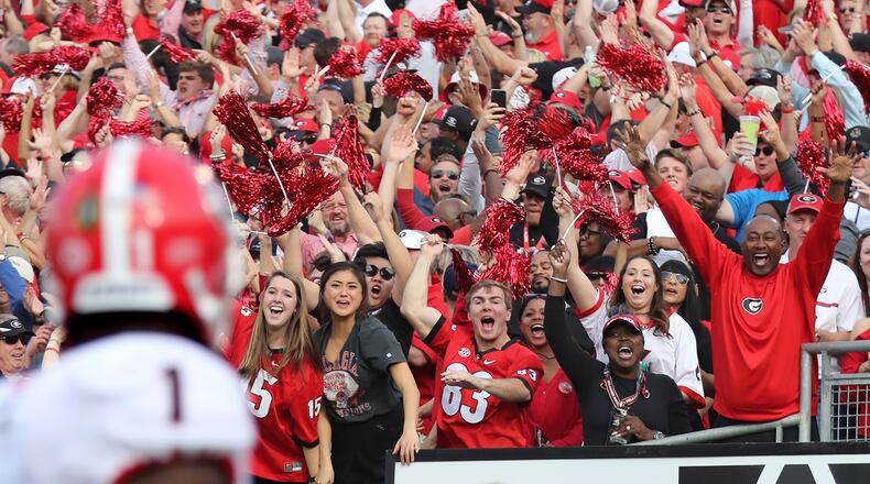 Sony Michel takes in the cheering Georgia fans as he scores his first touchdown run against Oklahoma at the Rose Bowl Game in Pasadena, Calif.