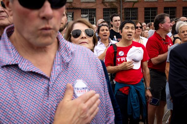 Fun Fong held his hat over his heart during the national anthem at Republican vice presidential candidate JD Vance’s rally in Lindale on Friday, Oct. 4, 2024. Fong, a Smyrna resident who ran unsuccessfully for state House in 2022, said it makes sense for campaigns on both sides of the aisle to court Asian American voters. "Asians have typically been wanting to stay out of the limelight. They don’t want to stick out. They’re probably afraid of expressing themselves a lot of time," he said. "So basically, both parties are recognizing that this demographic is an untapped resource that under votes. And I think that’s part of the attempt to promote partisan candidates."