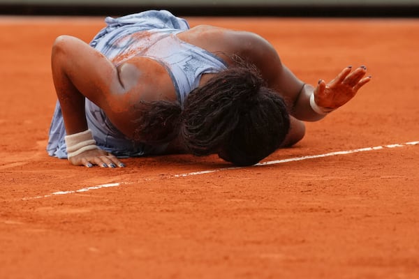 Coco Gauff of the U.S. celebrates as she won the final match of the French Tennis Open against Aryna Sabalenka of Belarus at the Roland-Garros stadium in Paris, Saturday, June 7, 2025. (AP Photo/Aurelien Morissard)