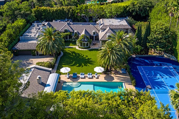 

Set on 1.25 acres in Beverly Hills, the manicured grounds hold a French country-inspired mansion, two guesthouses and a 60-foot swimming pool. (The Agency)