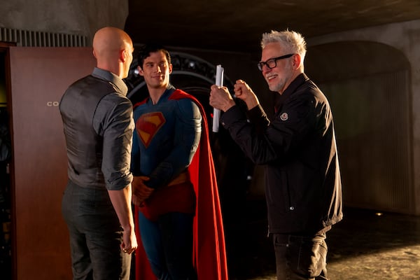 DC Studios chief and director James Gunn (right) works with David Corenswet (center) and Nicholas Hoult on the set of "Superman," which is the latest reboot of the original DC Comics superhero. (Courtesy of DC)