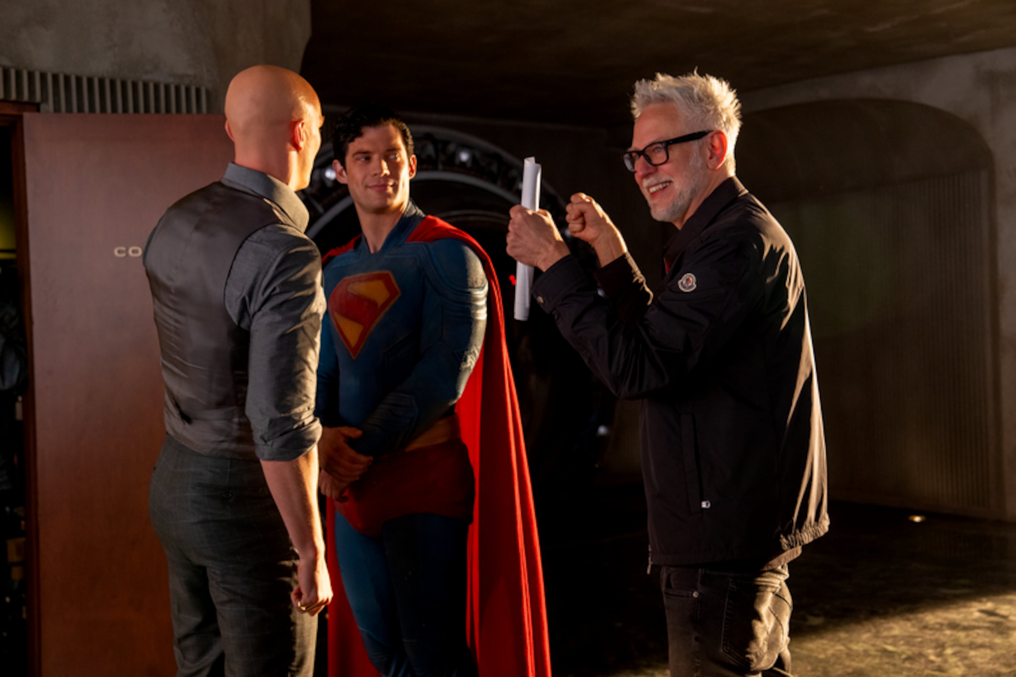 DC Studios chief and director James Gunn (right) works with David Corenswet (center) and Nicholas Hoult on the set of "Superman," which is the latest reboot of the original DC Comics superhero. (Courtesy of DC)