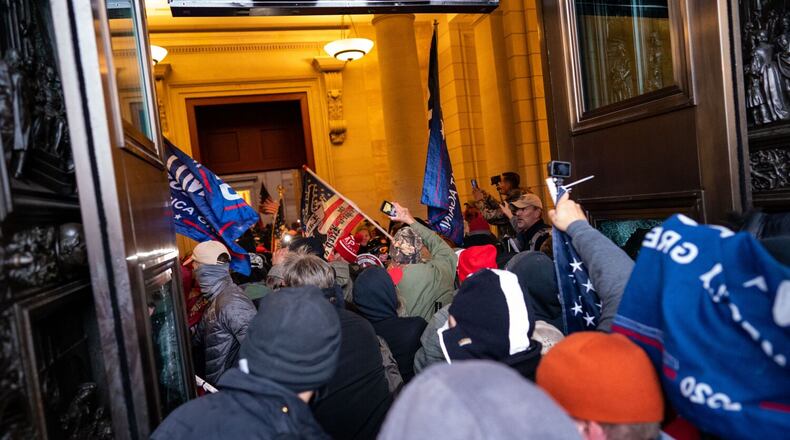 Insurrectionists stream into the U.S. Capitol building after breaching through the East Door on the second day of pro-Trump events fueled by President Donald Trump's continued claims of election fraud on Jan. 6, 2021 in Washington, D.C. (Kent Nishimura/Los Angeles Times/TNS)