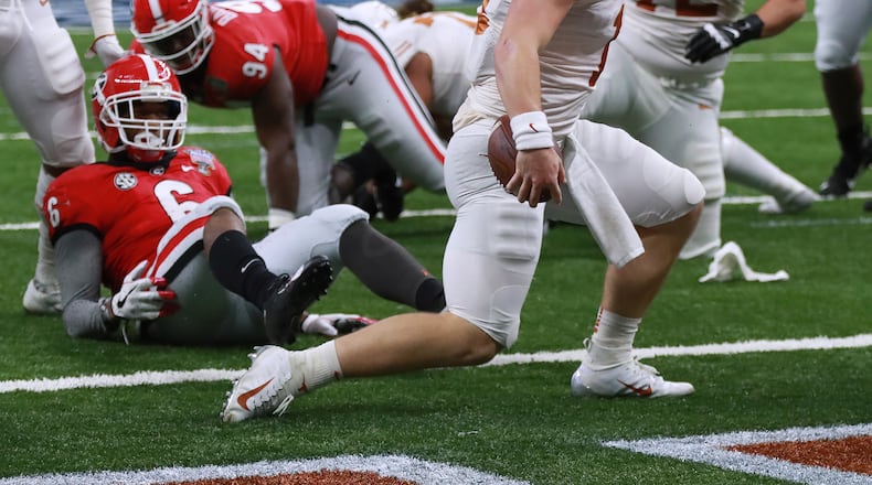Texas quarterback Sam Ehlinger scores his first touchdown in the Sugar Bowl at Mercedes-Benz Superdome on Tuesday,  Jan. 1, 2019, in New Orleans.