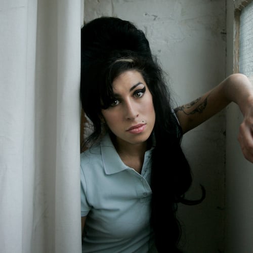 FILE - British singer Amy Winehouse poses for photographs after being interviewed by The Associated Press at a studio in north London, Friday, Feb. 16, 2007. (AP Photo/Matt Dunham, File)