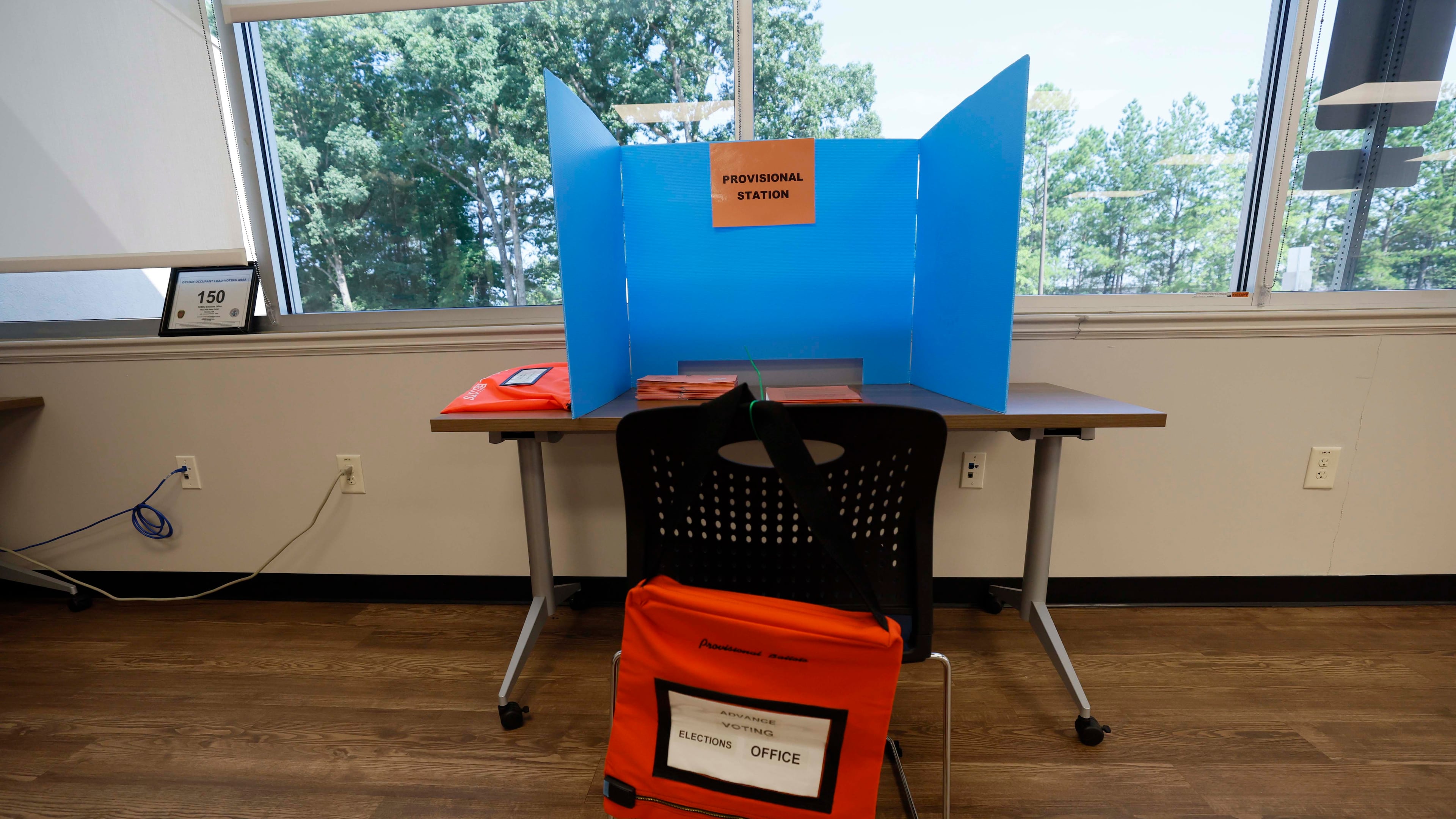 A provisional ballot desk is seen empty at the Cherokee County Voting and Registration office during the runoff elections for the Public Service Commission on Tuesday, July 8, 2025.
(Miguel Martinez/ AJC)