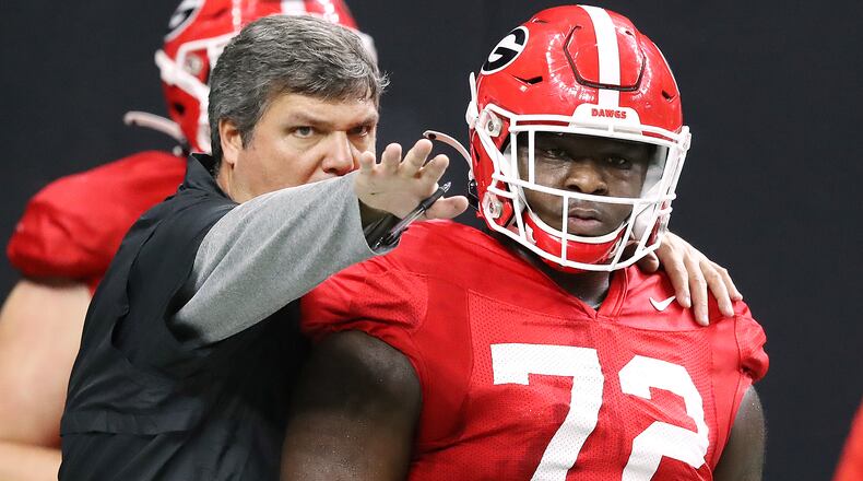 Georgia offensive line coach Matt Luke works with offensive lineman Netori Johnson during team practice Sunday, Dec. 29, 2019, as team prepares for the Sugar Bowl against Baylor at Mercedes-Benz Superdome in New Orleans. (Curtis Compton/ccompton@ajc.com)