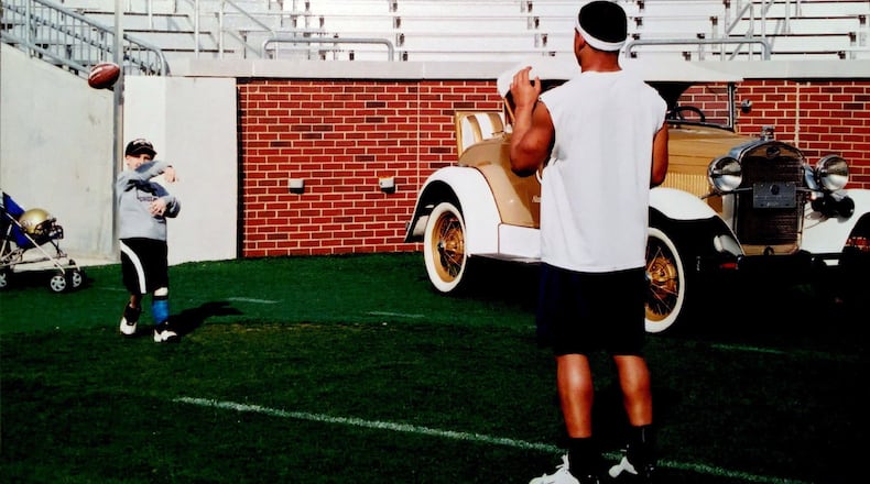 Carter Martin tosses the ball to Georgia Tech quarterback Reggie Ball inside Bobby Dodd Stadium in March 2004.