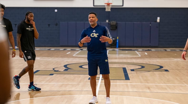 Georgia Tech men's basketball coach Damon Stoudamire works with his team during a practice.