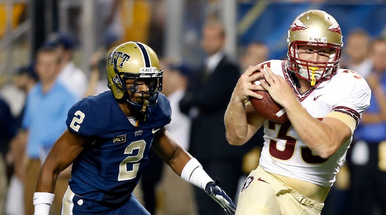 Florida State tight end Nick O'Leary (35) makes a catch for a touchdown in front of Pittsburgh linebacker Nicholas Grigsby (3) in the first quarter of the NCAA college football game, Monday, Sept. 2, 2013, in Pittsburgh. (AP Photo/Keith Srakocic)