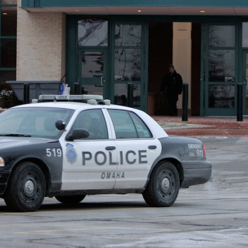 FILE - An Omaha police car drives on Dec. 8, 2007, in Omaha, Neb. (AP Photo/Jeff Roberson, File)