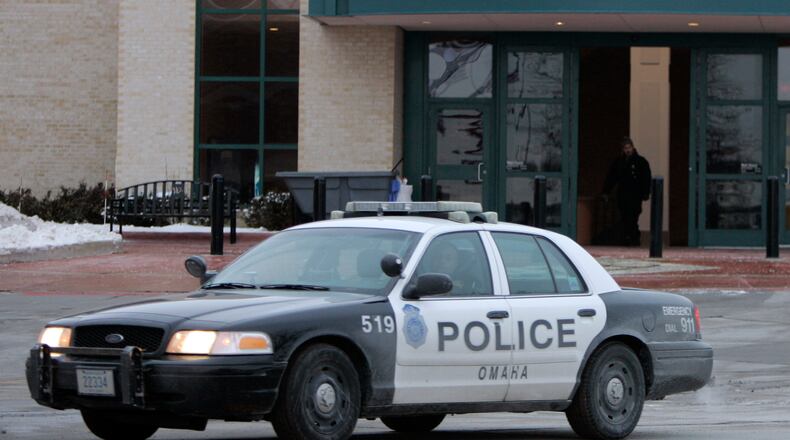 FILE - An Omaha police car drives on Dec. 8, 2007, in Omaha, Neb. (AP Photo/Jeff Roberson, File)