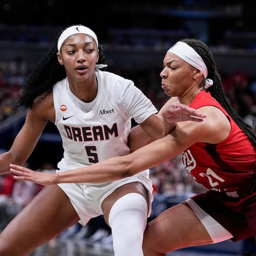 Indiana Fever forward Makayla Timpson (21) defends Atlanta Dream forward Angel Reese (5) in the second half of a WNBA basketball game in Indianapolis, Thursday, June 18, 2026. (AP Photo/Michael Conroy)