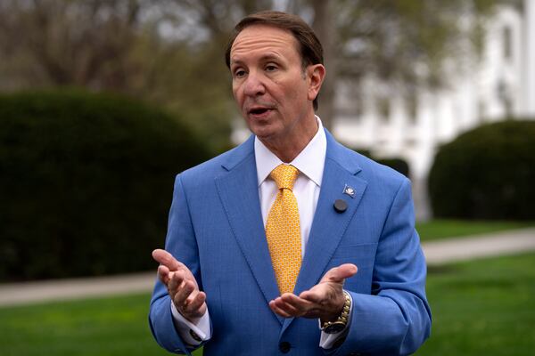 Louisiana Gov. Jeff Landry records a social media video outside the White House, Monday, March 24, 2025, in Washington. (AP Photo/Mark Schiefelbein)