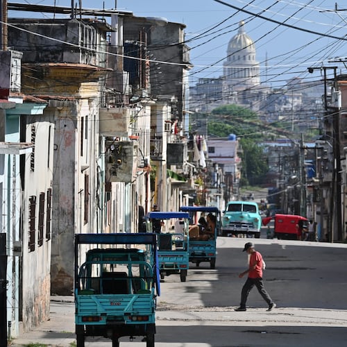 A man crosses a street in Havana, Monday, May 25, 2026. (AP Photo/Jorge Luis Banos)