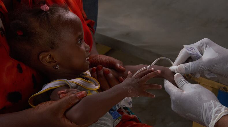 A child suffering from cholera has a blood sample taken at the MSF treatment centre in Maiduguri, Nigeria, Monday, June 8, 2026. (AP Photo/Jude Mike)