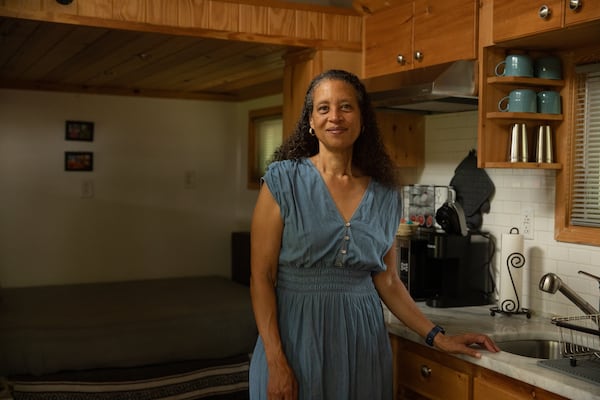 Cabbagetown resident Nadia Giordani rents out a tiny home in her backyard. (Riley Bunch/AJC)