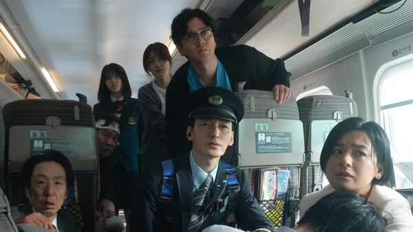 This image released by Netflix shows Tsuyoshi Kusanagi, center, in a scene from "Bullet Train Explosion." (Netflix via AP)