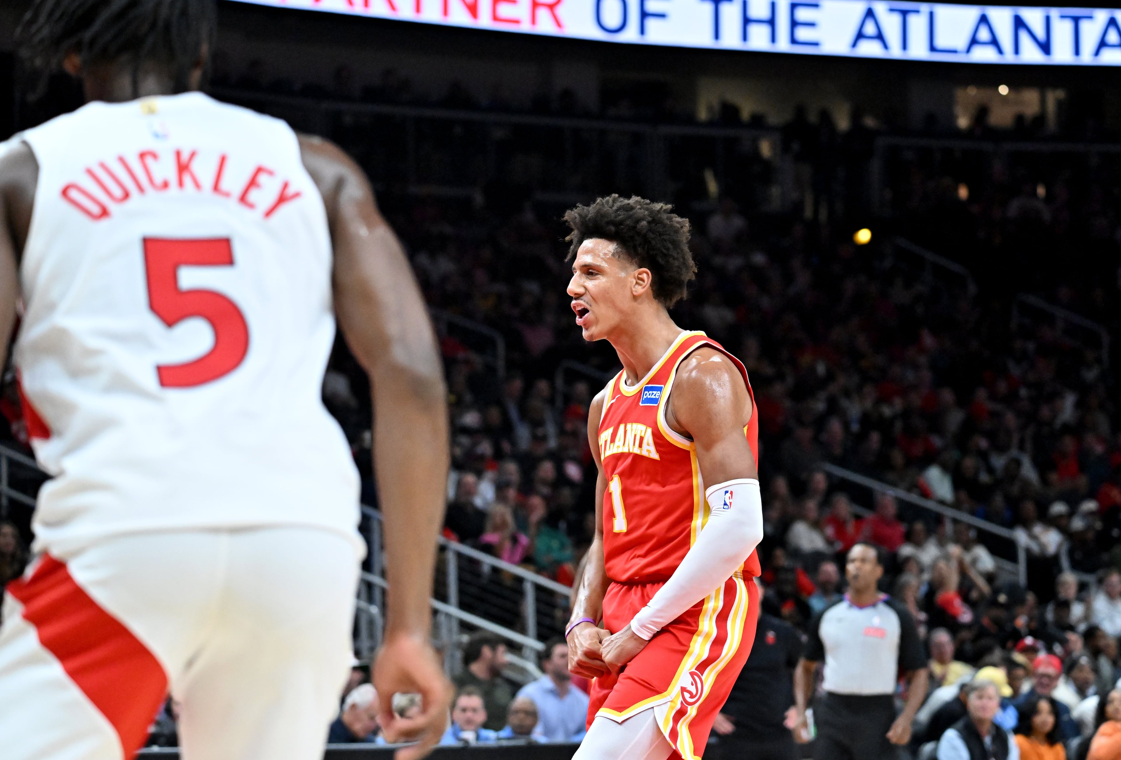 Atlanta Hawks forward Jalen Johnson (1) reacts after scoring during the second half in the home opener at State Farm Arena, Thursday, October 22, 2025, in Atlanta. Toronto Raptors won 138-118 over Atlanta Hawks. (Hyosub Shin / AJC)