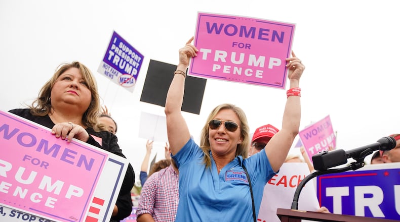 Marjorie Greene, center, of Milton, and candidate for congress in the sixth district, participates in a "Stop Impeachment Now" rally outside the office of Rep. Lucy McBath on Wednesday, October 9, 2019, in Sandy Springs. (Elijah Nouvelage for The Atlanta Journal-Constitution)