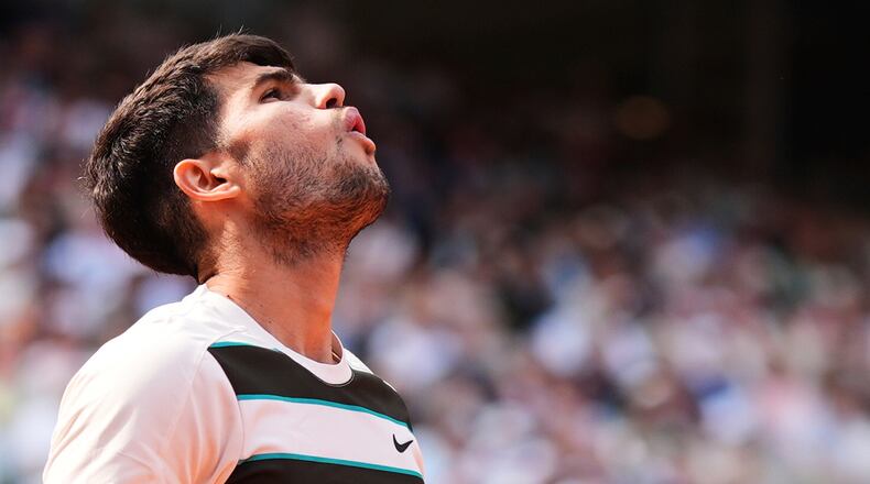 FILE - Spain's Carlos Alcaraz reacts during the final of the French Open tennis tournament against Italy's Jannik Sinner, Sunday, June 8, 2025, in Paris. (AP Photo/Lindsey Wasson, File)