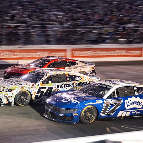 Roush Fenway Keselowski Racing driver Chris Buescher (17) and Joe Gibbs Racing driver Ty Gibbs (54) battle in turn one during Cook Out 400 at Richmond Raceway, Saturday, Aug. 15, 2026, in Richmond Va. (AP Photo/Robert Simmons)